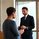 A friendly consultant discussing cleaning needs with a client.