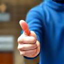 A supervisor with a thumbs-up signifying a job well done.